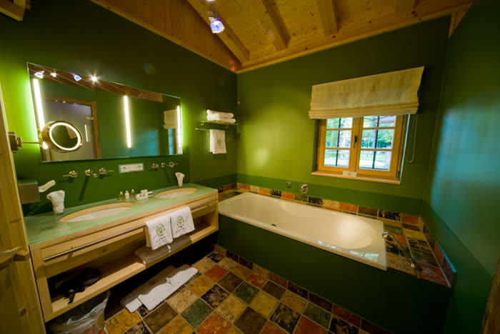 Bathroom with walls in a rich green