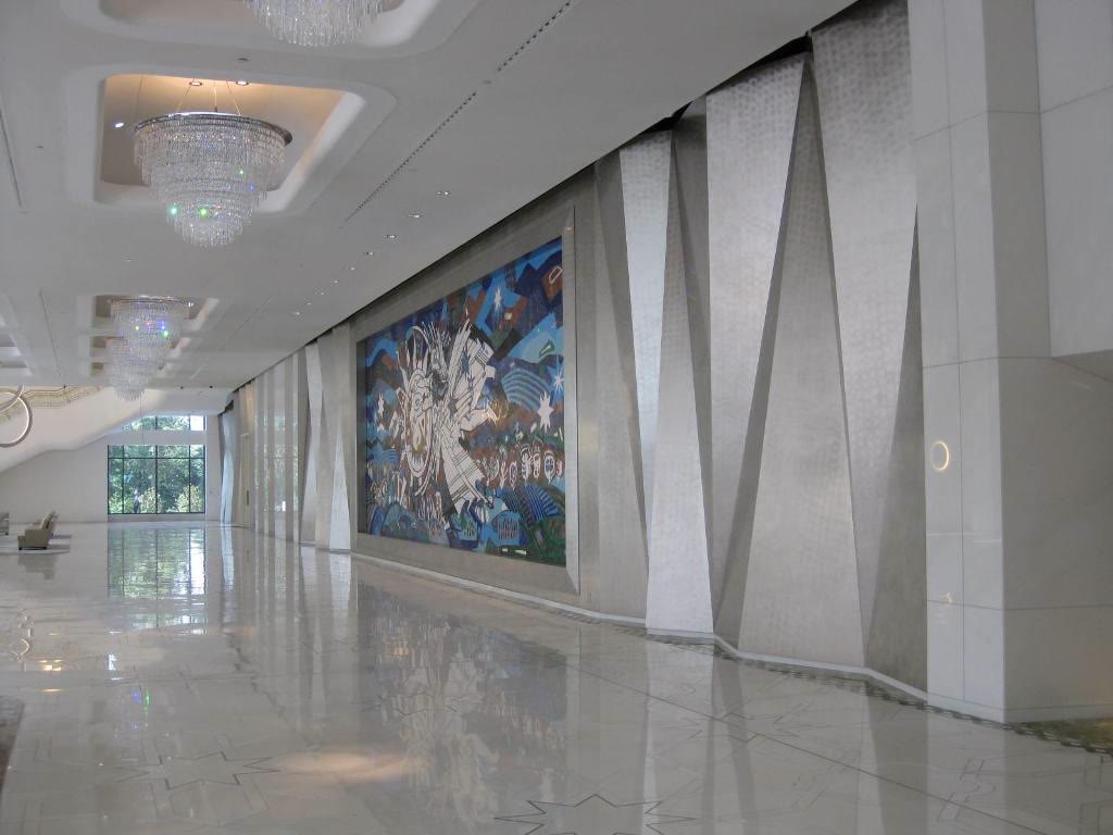 Lobby with large folded wall panels in metallic finish