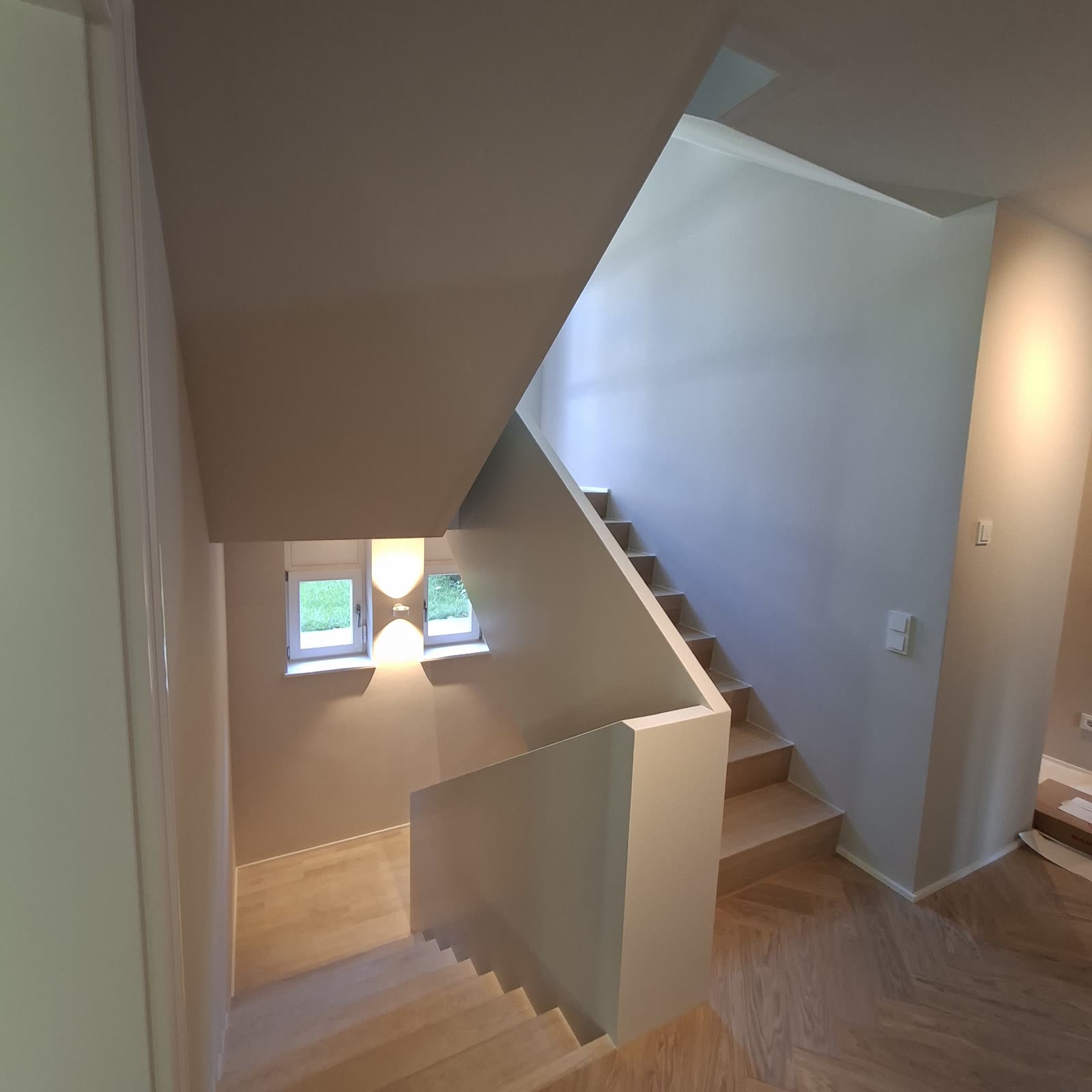 Freshly painted stairwell with wooden steps